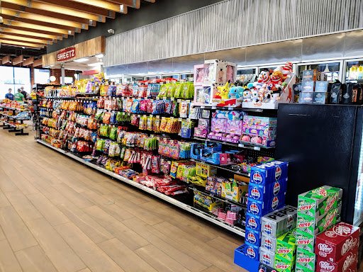 A busy convenience store shows how much easier shopping is than worrying about septic systems, like those fixed by Drain Bros llc.