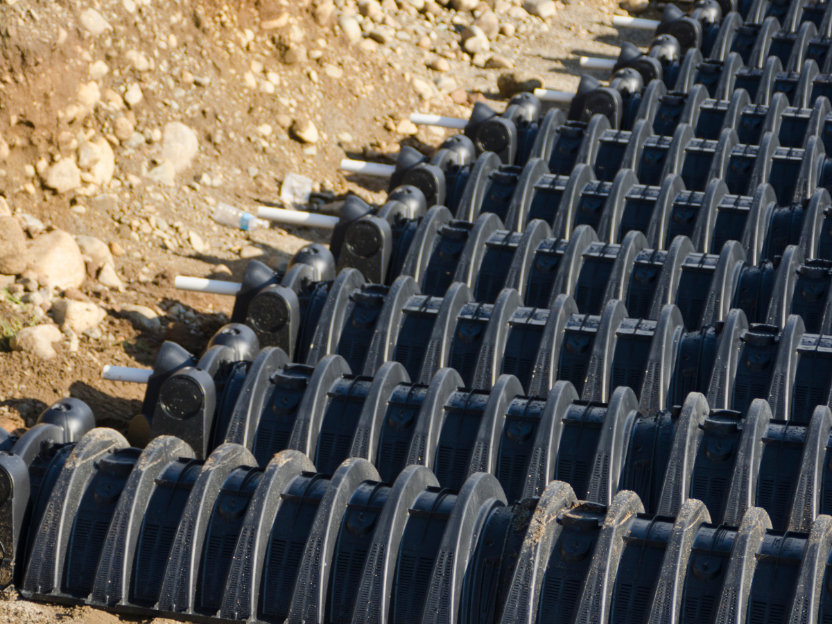 Drain Bros llc installs underground systems for stormwater or septic needs during home excavation projects.