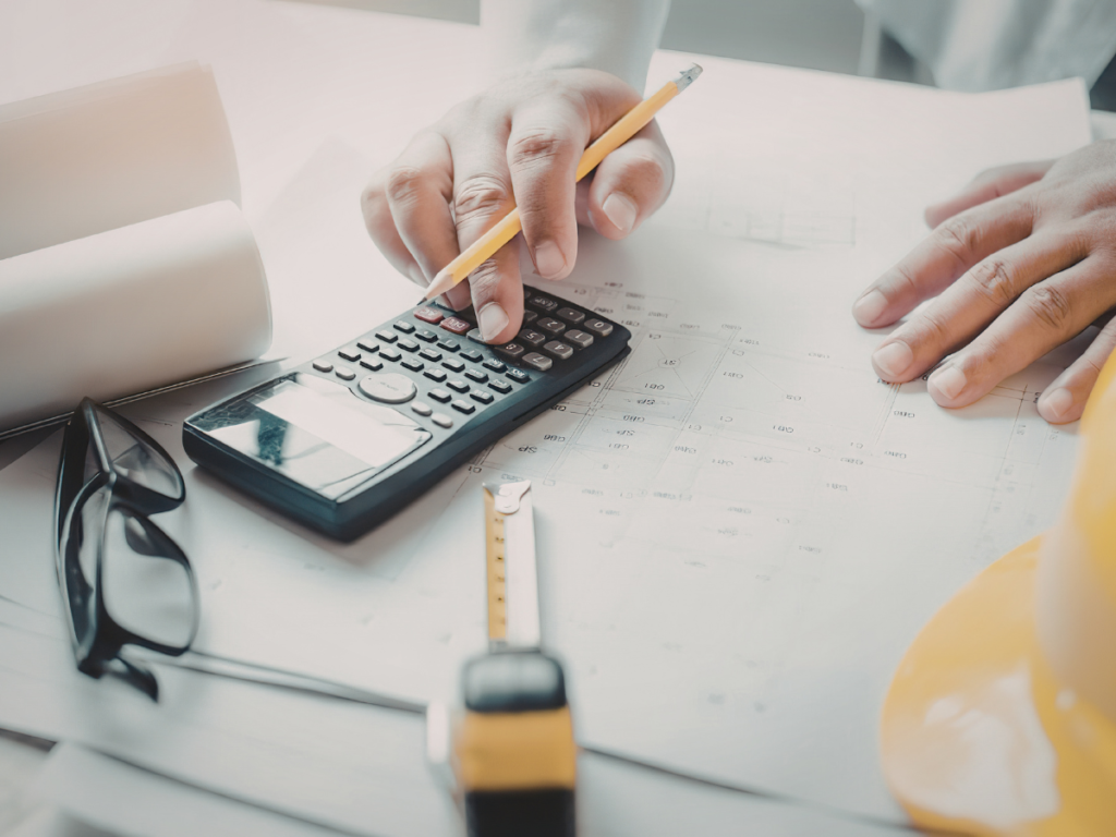 Drain Bros llc staff planning a drainage system, preparing for plumbing and excavation work on a construction project.