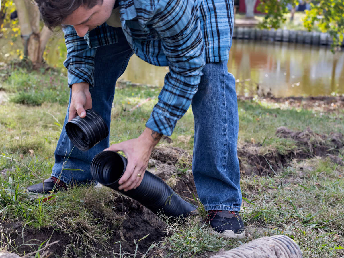 Drain Bros llc provides home drainage solutions, showing how a yard is improved with expert excavation and system installation.