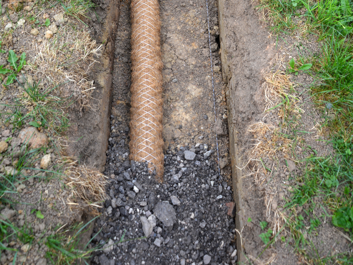 Drain Bros llc installing a septic system pipe, showing how proper setup helps drains work well for homes.