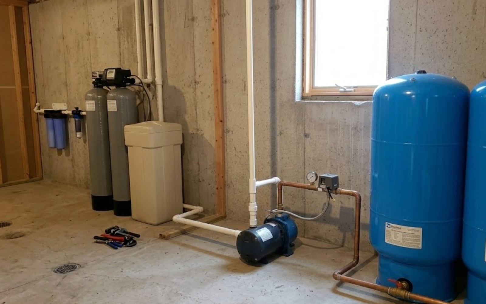 Drain Bros llc helps homes with clean water and drainage needs, showing where new systems can be set up in a basement.