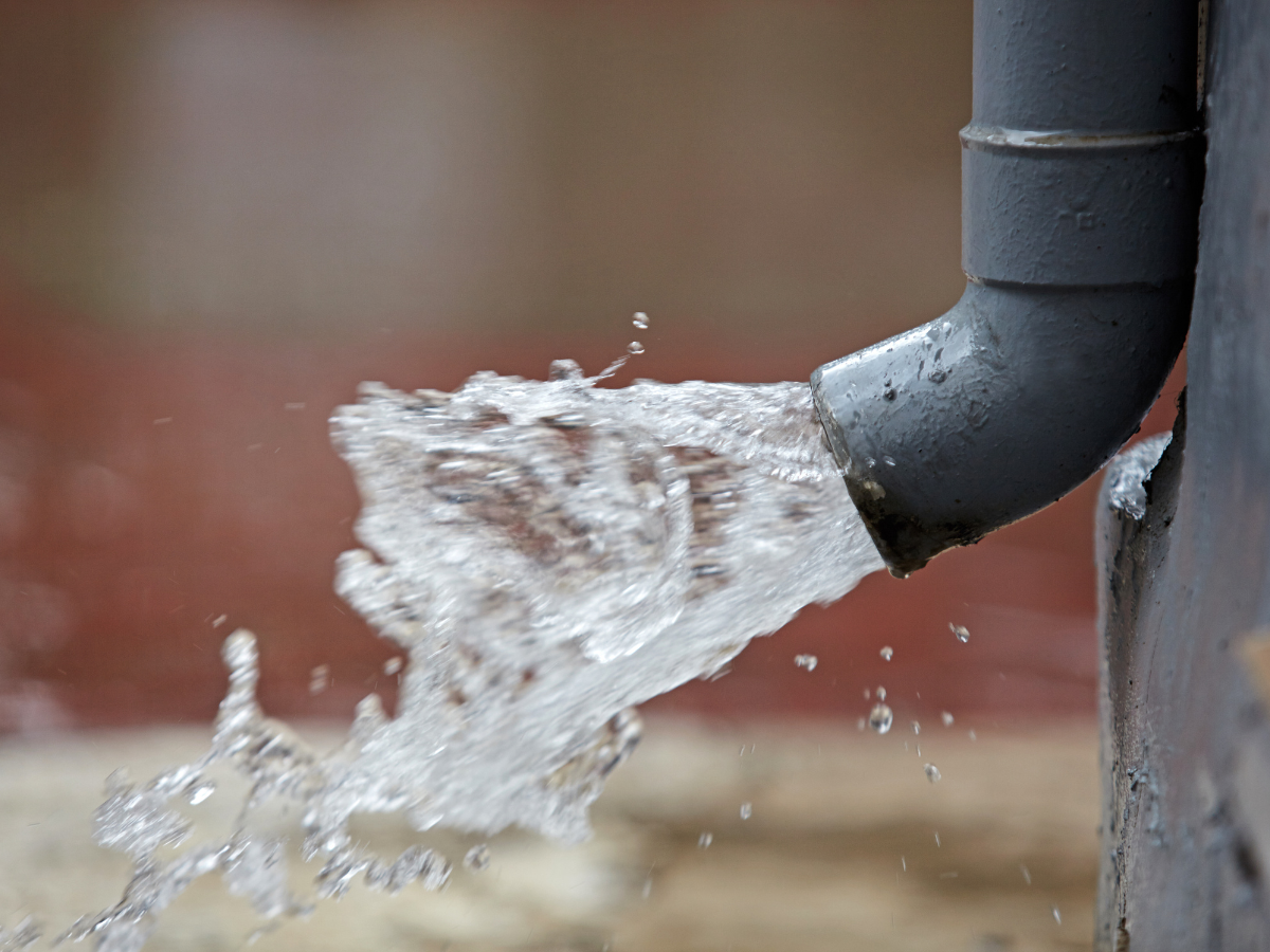 Drain Bros llc helps fix water flow problems from pipes, showing clear water moving out during plumbing repairs.