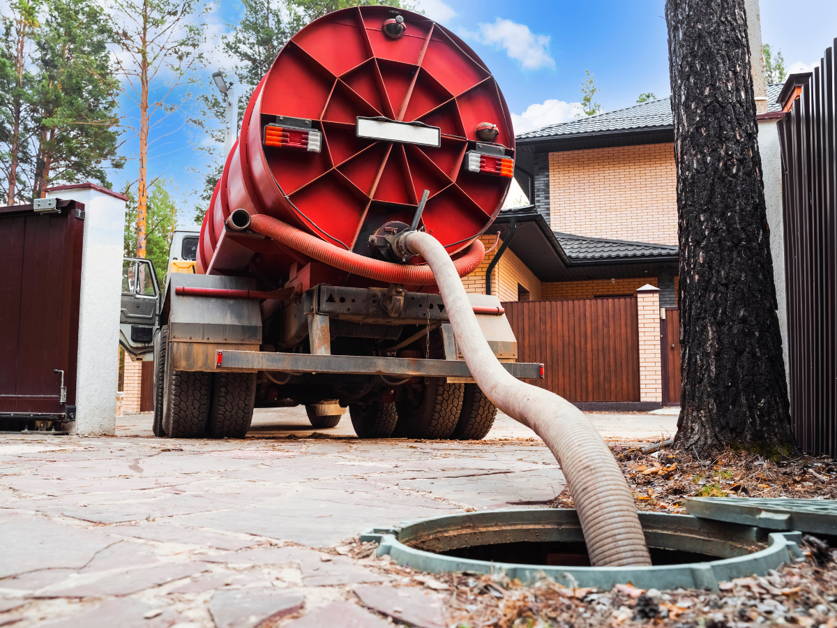 Drain Bros llc is helping a house with septic tank service, showing fast and reliable emergency support.